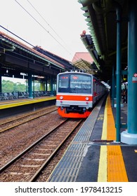 Jakarta, Indonesia - May 18, 2021: A Commuter Train Went Fast, Crossing The Gambir Railway Station In Jakarta