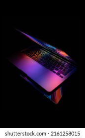 JAKARTA, INDONESIA - May 26, 2022: Macbook Pro 13 Inch 2020 With Colorful Wallpaper On Black Background