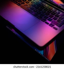 JAKARTA, INDONESIA - May 26, 2022: Macbook Pro 13 Inch 2020 With Colorful Wallpaper On Black Background