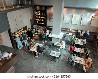 JAKARTA, INDONESIA - May 29, 2022: Breakfast Atmosphere Of Visitors And Guests Of A Boutique Hotel With A Modern Minimalist Interior, Some Sit And Eat At The Table, And Some Take Food And Drinks