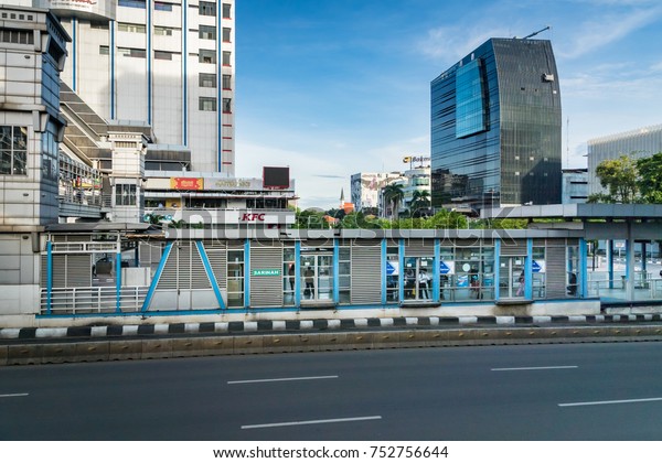 Jakarta,\
Indonesia - November 2017: Transjakarta bus station in central\
Jakarta. Transjakarta is the first BRT (Bus Rapid Transit) system\
developed in South and South East\
Asia.