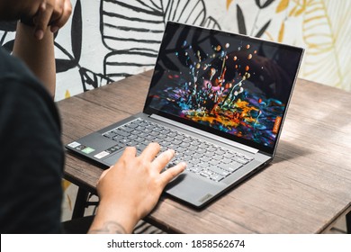 Jakarta, Indonesia - November 21, 2020:  The Lenovo Yoga Slim 7i Fabric Cover Edition has a 14-inch 1080p IPS LCD display. The hinge allows you to flex the lid in an angle of 180-degrees.