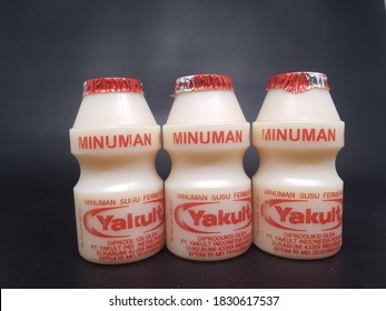 Jakarta, Indonesia -  Oct 10,  2020: Yakult Fermented Milk Drink On Dark Isolated Background. Healthy Probiotic Drink With The Bacteria Strain Lactobacillus Paracasei Shirota