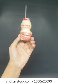 Jakarta, Indonesia -  Oct 10,  2020: Yakult Fermented Milk Drink On Dark Isolated Background. Healthy Probiotic Drink With The Bacteria Strain Lactobacillus Paracasei Shirota