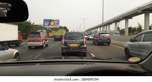 Jakarta, Indonesia - Oct 2019: View From Car Dashboard Camera, A Traffic Jam In A Toll Road Or Highway Leaving The City. 