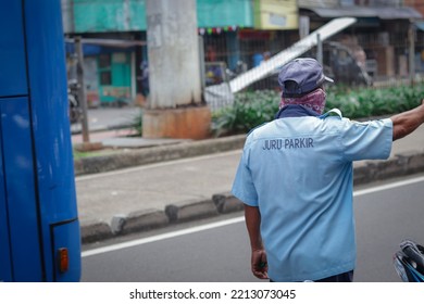 Jakarta, Indonesia - October 10 2022: An Old Man Is Directing Traffic On The Road