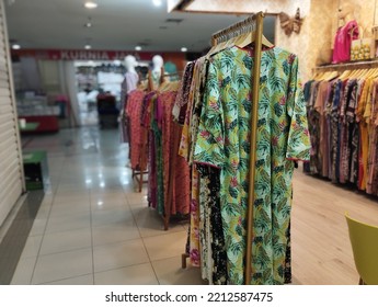 Jakarta, Indonesia - October 11, 2022: Various Womens Dress On Display Hanger Inside A Small Fashion Store. Eye Level Angle. Selective Focus. Fashion Store Concept.