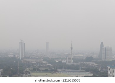 Jakarta, Indonesia.
October 19, 2022.

An Example Of A Bad Quality Image, Not Sharp, Blurry, Noise And Gray Sky Of The Jakarta's Aerial City Scape View Due To The Thick Fog Of Air Pollution.