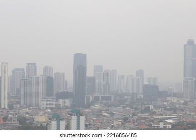 Jakarta, Indonesia. 
October 19, 2022. 

An Example Of A Bad Quality Image, Not Sharp, Blurry, Noise And Gray Sky Of The Jakarta's Aerial City Scape View Due To The Thick Fog Of Air Pollution.