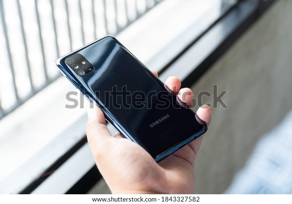 Jakarta, Indonesia -\
October 29, 2020: The back of Samsung Galaxy M51 in Celestial Black\
colour. The centerpiece feature of the phone is the humongous 7,000\
mAh battery. 
