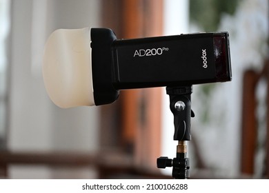 jakarta, indonesia on jan 01, 2022: defocused. a Godox ad200pro for camera flash and video productipn light on photoshot session, used for film shooting and videography. selective focus