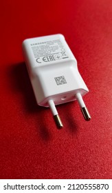 Jakarta, Indonesia On Jan 31, 2022: Defocused. Samsung Mobile Phone Charger Head Which Is White On A Red Background. Selective Focus  