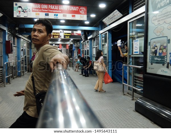 Jakarta, Indonesia : People of Jakarta\
using Busway, a single mini bus as public transportation in Blok M\
terminal, Jakarta\
(07/2017).\
\
