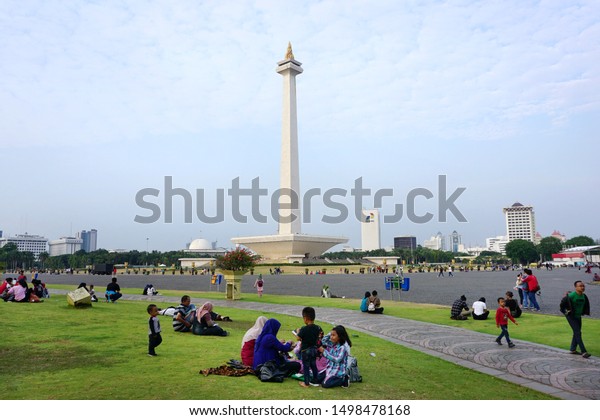 Jakarta, Indonesia Sept.7, 2019: People\
vacation at Monas Park. Monas (National monument)  was built in\
1975 as a symbol of the struggle people of Indonesia for\
independence from the Dutch\
goverment.