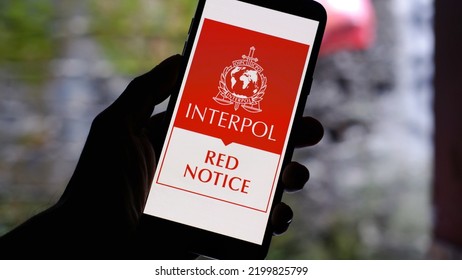 Jakarta, Indonesia - September 07,2022:  Interpol Red Notice Logo Displayed On Smartphone. Interpol Red Notice Is Closest Instrument To An International arrest Warrant in Use Today.