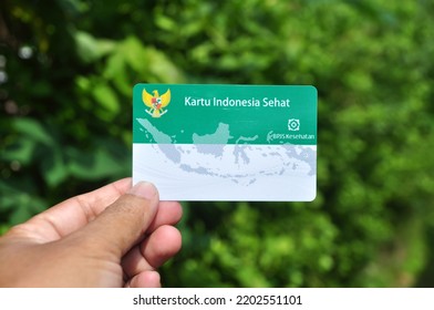 Jakarta, Indonesia - September 12, 2022 : Holds A Healthy Indonesia Card (Health Insurance Card From The Government Of Indonesia) And Indonesian Identity Card