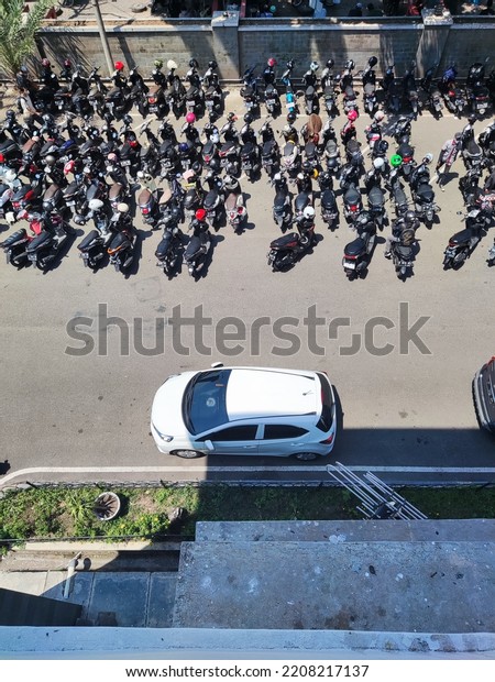Jakarta, Indonesia -\
September 30, 2022 - Motorcycle Parking Lot at the Hospital, in the\
photo from above.