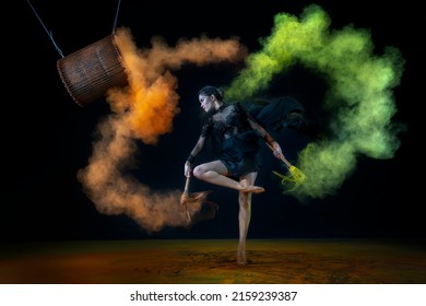 Jakarta, Indonesia-15 May 2022: A dancer is dancing beautifully with drum and colorful powder