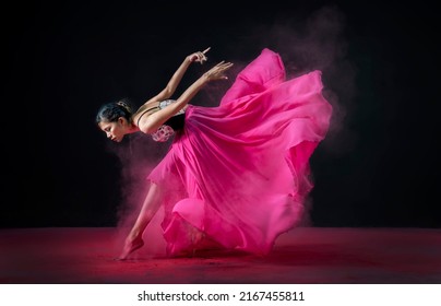 Jakarta, Indonesia-15 may 2022: A pretty ballerina is dancing with pink dress beautifully