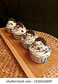 Jakarta. Jawa Barat Indonesia March 17, 2022 Cup Cake With Oreo Biscuit Topping Which Is Delicious In The Kitchen On A Wooden Tray