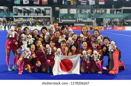 Jakarta,Indonesia - August 31, 2018 : Japanese Women Hockey Team Celebrated Their Gold Medal Achievement After Beating India 2-1 In The Women Hockey Asian Games 2018 Final At Gelora Bung Karno Stadium