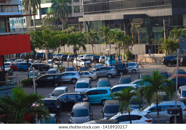 JAKARTA,INDONESIA, JUNE 8 2019 : Cars Crowded\
parking lot in downtown and\
messy