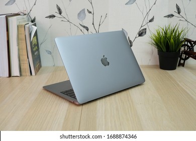 Jakarta-Indonesia, Monday 31 March 2020, MacBook pro retina gray on a wooden table