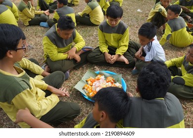 Jakarta,indonesia-august 2022:a Group Of Students Eating Together In One Big Tray With Joy And Enthusiasm