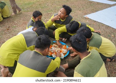 Jakarta,indonesia-august 2022:a Group Of Students Eating Together In One Big Tray With Joy And Enthusiasm