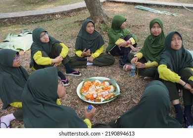 Jakarta,indonesia-august 2022:a Group Of Students Eating Together In One Big Tray With Joy And Enthusiasm