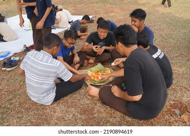 Jakarta,indonesia-august 2022:a Group Of Students Eating Together In One Big Tray With Joy And Enthusiasm