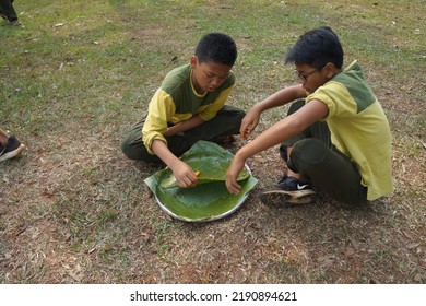 Jakarta,indonesia-august 2022:a Group Of Students Eating Together In One Big Tray With Joy And Enthusiasm