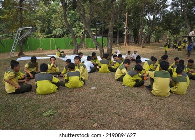 Jakarta,indonesia-august 2022:a Group Of Students Eating Together In One Big Tray With Joy And Enthusiasm