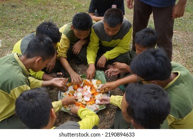 Jakarta,indonesia-august 2022:a Group Of Students Eating Together In One Big Tray With Joy And Enthusiasm