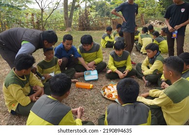 Jakarta,indonesia-august 2022:a Group Of Students Eating Together In One Big Tray With Joy And Enthusiasm