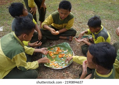 Jakarta,indonesia-august 2022:a Group Of Students Eating Together In One Big Tray With Joy And Enthusiasm