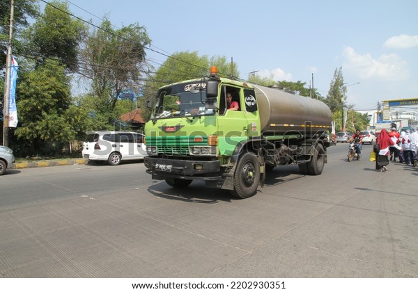 jakarta,indonesia-september 2022:vegetable oil\
tanker truck passing on the\
highway