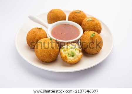 jalapeno cheese balls or poppers served with tomato ketchup