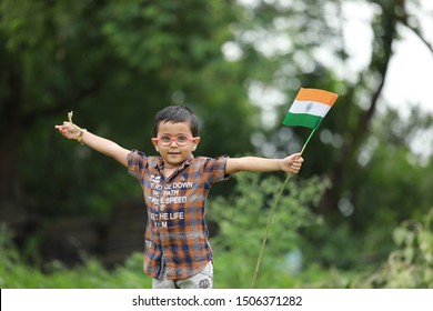 Jalgaon Maharashtra/India -7th August 2017 : Cute little boy with Indian National Tricolour Flag. Independence Day or Republic Day concept.