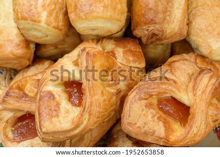 Jam buns. The buns are shaped like an envelope. Puff pastry.