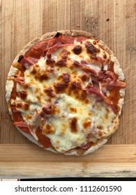 Jam And Cheese Pitta Pizza Over Wooden Table. 