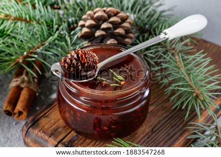 
Jam from young pine cones. National Russian food. Anti-cold folk remedy.