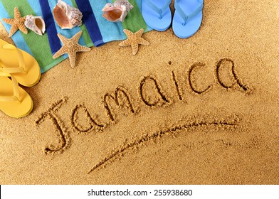 Jamaica beach : the word Jamaica written on a sandy beach.