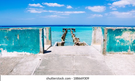 Jamaica Blue Docks 2. The remains of an old dock off a Caribbean white sand beach on the northern coast of Jamaica, near Dunn's River Falls and the town of Ocho Rios.