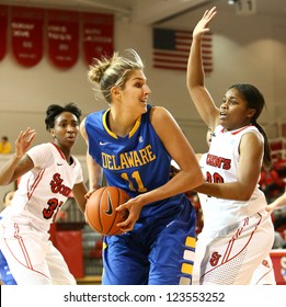 JAMAICA, NY-JAN 2: Delaware Blue Hens Guard Elena Delle Donne (11) Shoots Around St. John's Red Storm Guard Keylantra Langley (20) At Carnesecca Arena On January 2, 2013 In Jamaica, New York.