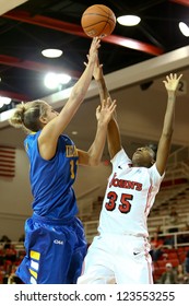 JAMAICA, NY-JAN 2: Delaware Blue Hens Guard Elena Delle Donne (11) Shoots Over St. John's Red Storm Guard Shenneika Smith (35) At Carnesecca Arena On January 2, 2013 In Jamaica, Queens, New York.