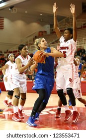 JAMAICA, NY-JAN 2: Delaware Blue Hens Guard Elena Delle Donne (11) Shoots As St. John's Red Storm Guard Shenneika Smith (35) Defends At Carnesecca Arena On January 2, 2013 In Jamaica, New York.