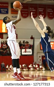 JAMAICA-FEB 2: St. John's Red Storm Guard Shenneika Smith (35) Shoots Over Connecticut Huskies Guard Kelly Faris (34) At Carnesecca Arena On February 2, 2013 In Jamaica, Queens, New York.