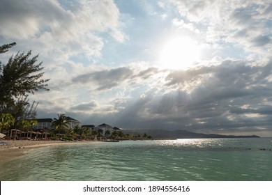 Jamaican beach with awesome sunset and sunrays.