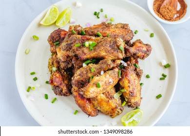 Jamaican / Caribbean Jerk Chicken Wings / Dry Rub Chicken Wings On A Plate - Top View. Popuylar Chicken Appetizer, American Cuisine.